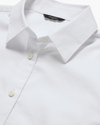 View of model wearing Lucent White Signature Shirt with Stain Defender®, Slim Fit.