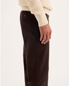 Side view of model wearing Mole Ultimate Chinos, Slim Fit.
