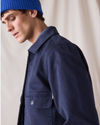 View of model wearing Navy Blue Dockers® x Transnomadica Mechanics Jacket.