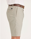 Side view of model wearing Sahara Khaki Men's Supreme Flex Modern Chino Short.