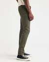 Side view of model wearing Army Green Men's Skinny Fit Original Chino Pants.