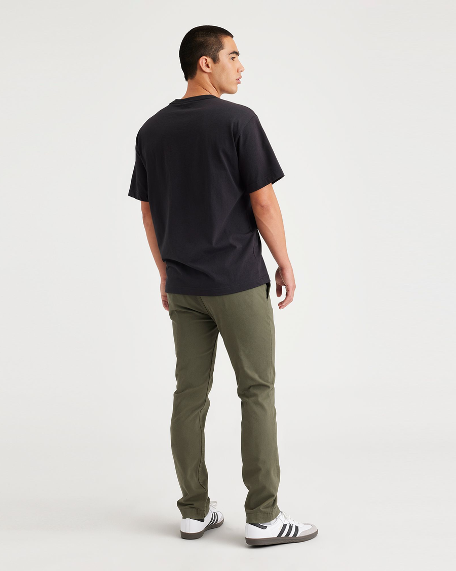 Back view of model wearing Army Green Men's Skinny Fit Smart 360 Flex California Chino Pants.