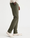 Side view of model wearing Army Green Men's Slim Fit Smart 360 Flex California Chino Pants.