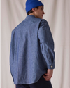 Back view of model wearing Bay Chambray Dockers® x Transnomadica Dock Shirt.