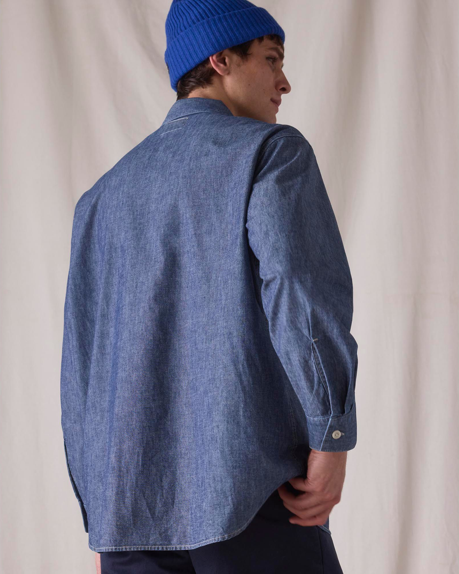 Back view of model wearing Bay Chambray Dockers® x Transnomadica Dock Shirt.