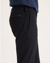 Side view of model wearing Beautiful Black Go Activeflex Chino, Skinny Fit.