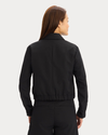 Back view of model wearing Beautiful Black Go Jacket with AceFlex, Regular Fit.