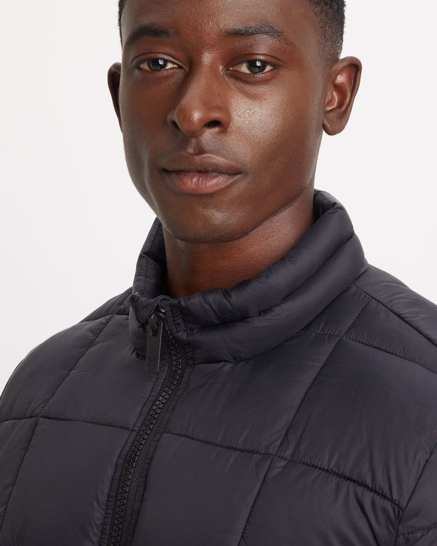 View of model wearing Beautiful Black Men's Nylon Lightweight Quilted Jacket.