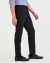 Side view of model wearing Beautiful Black Men's Slim Tapered Fit Refined Pull-On Pants.