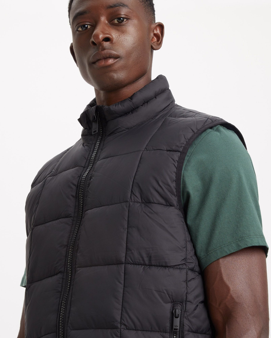 View of model wearing Beautiful Black Quilted Vest, Regular Fit.