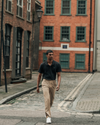 View of model wearing Beautiful Black Signature Go Khaki Pants, Slim Fit.