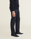 Side view of model wearing Beautiful Black Signature Go Khaki Pants, Slim Fit.