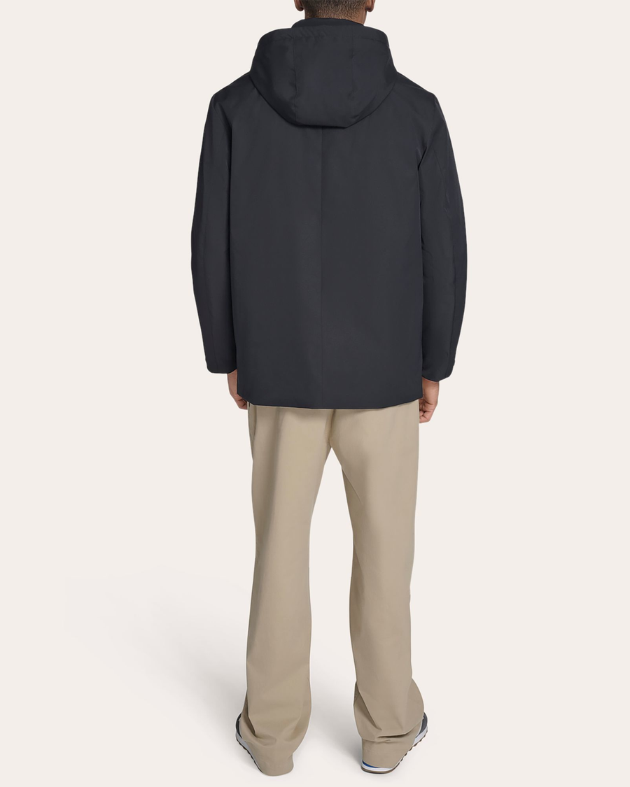 Back view of model wearing Black Go Rain Commuter Jacket.