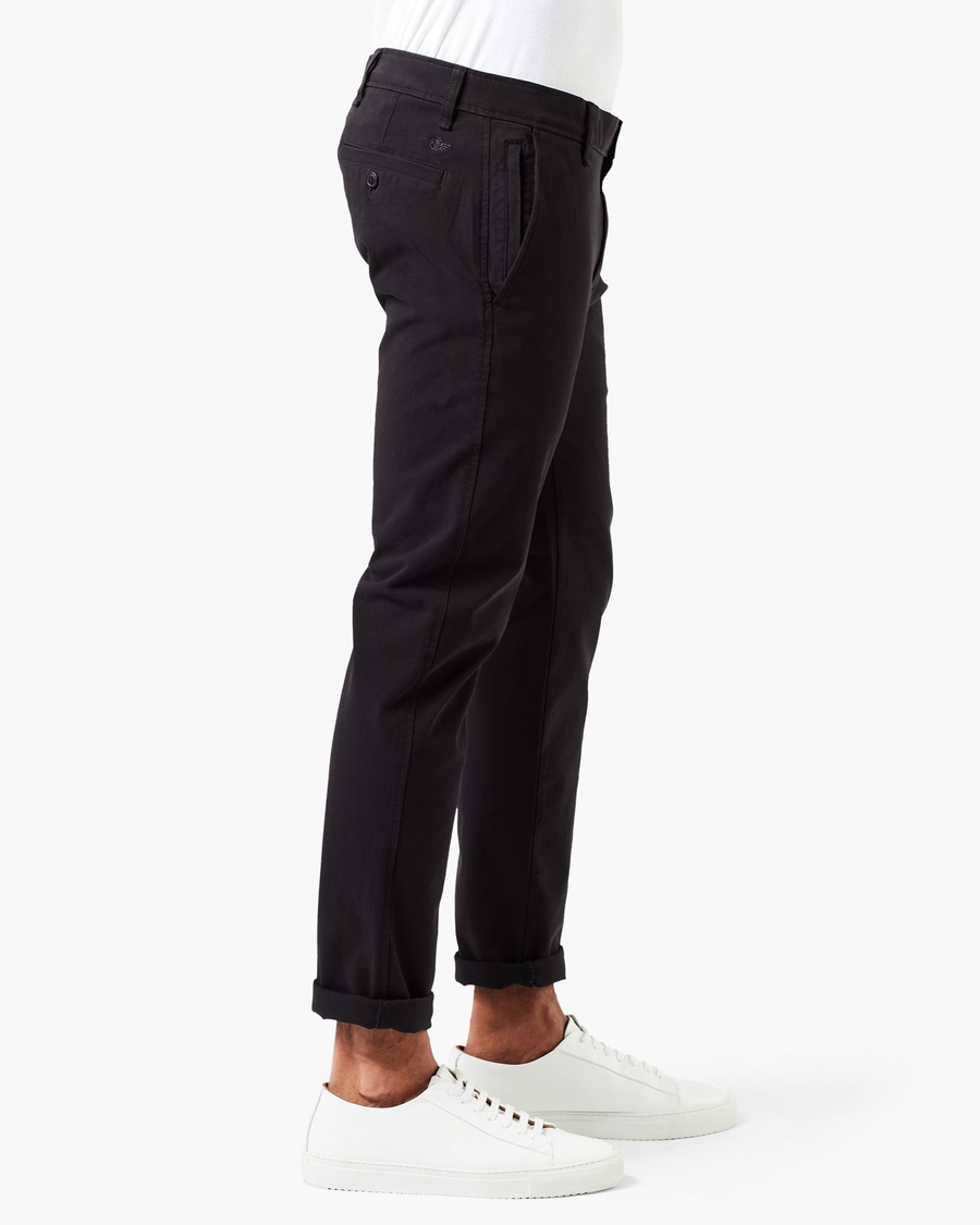 Side view of model wearing Black Men's Smart 360 Flex Ultimate Chino.