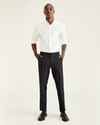 Front view of model wearing Black Men's Straight Fit Smart 360 Flex Workday Khaki Pants.