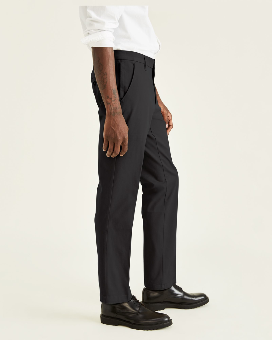 Side view of model wearing Black Men's Straight Fit Smart 360 Flex Workday Khaki Pants.