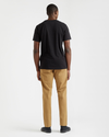 Back view of model wearing Black Stencil Graphic Tee, Slim Fit.