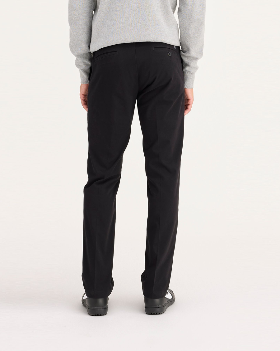 Back view of model wearing Black Workday Khaki Pants, Slim Fit.