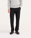 Front view of model wearing Black Workday Khaki Pants, Slim Fit.