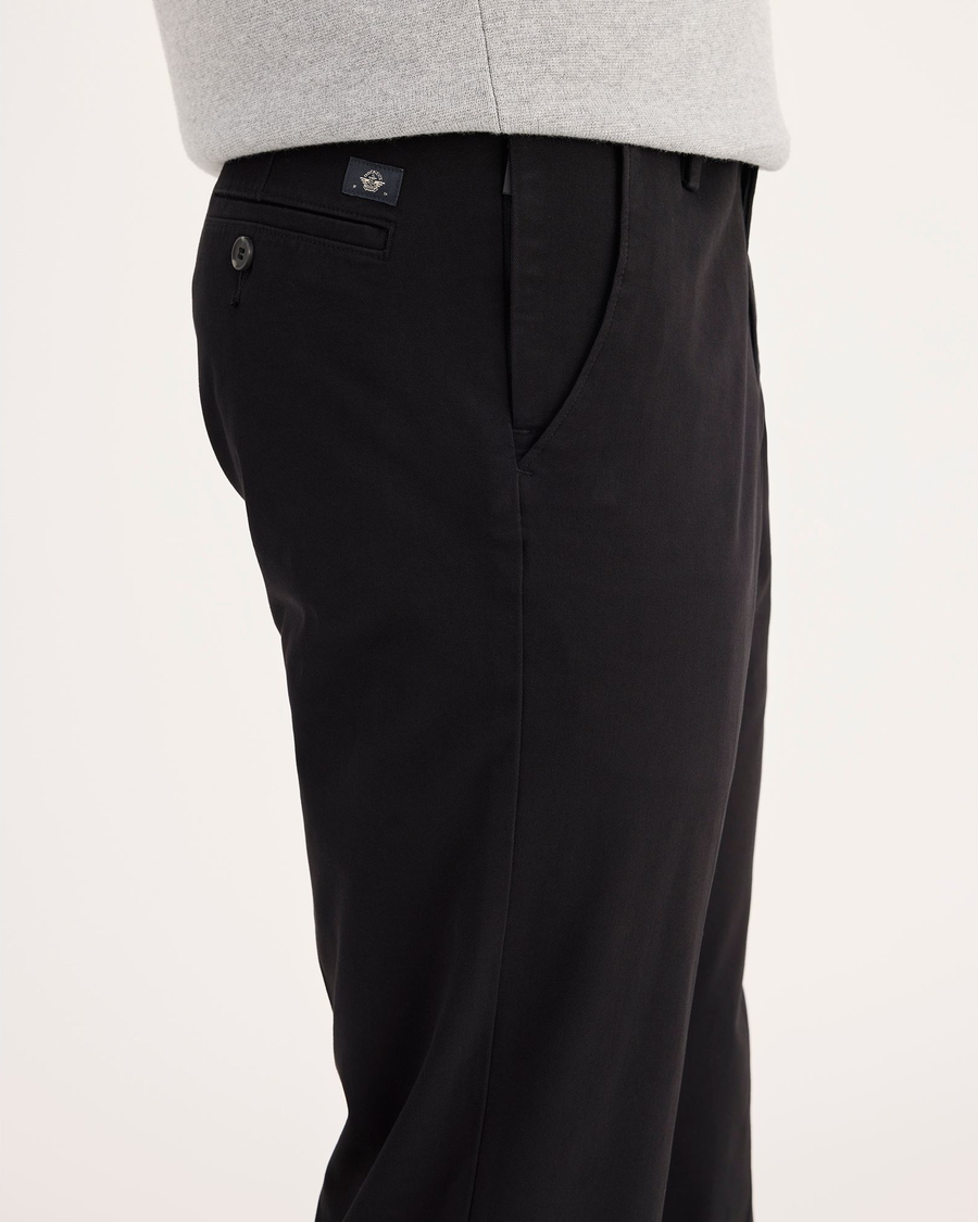 Side view of model wearing Black Workday Khaki Pants, Slim Fit.