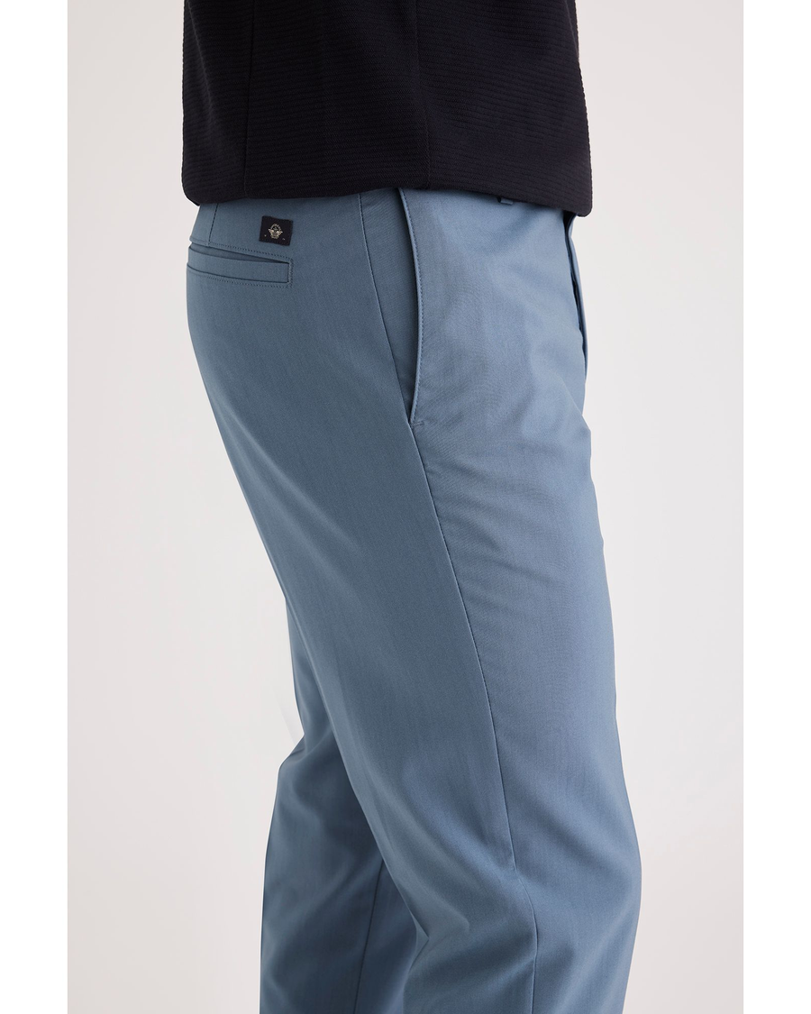 Side view of model wearing Bluefin Signature Go Khakis, Slim Fit.