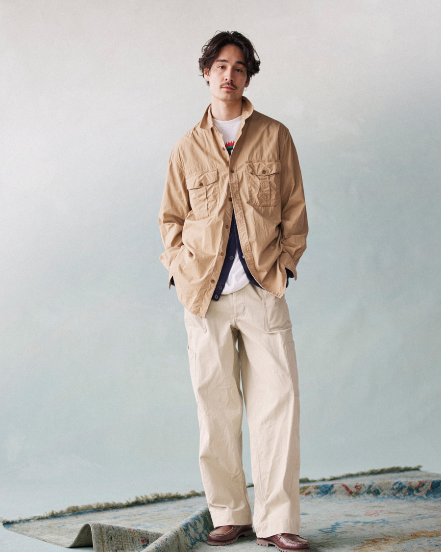 View of model wearing Broad Khaki Dockers® x Transnomadica Officer Shirt.