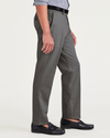 Side view of model wearing Burma Grey Signature Iron Free Khakis, Creased, Slim Fit with Stain Defender®.