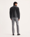 Back view of model wearing Burma Grey Signature Iron Free Khakis, Skinny Fit with Stain Defender®.