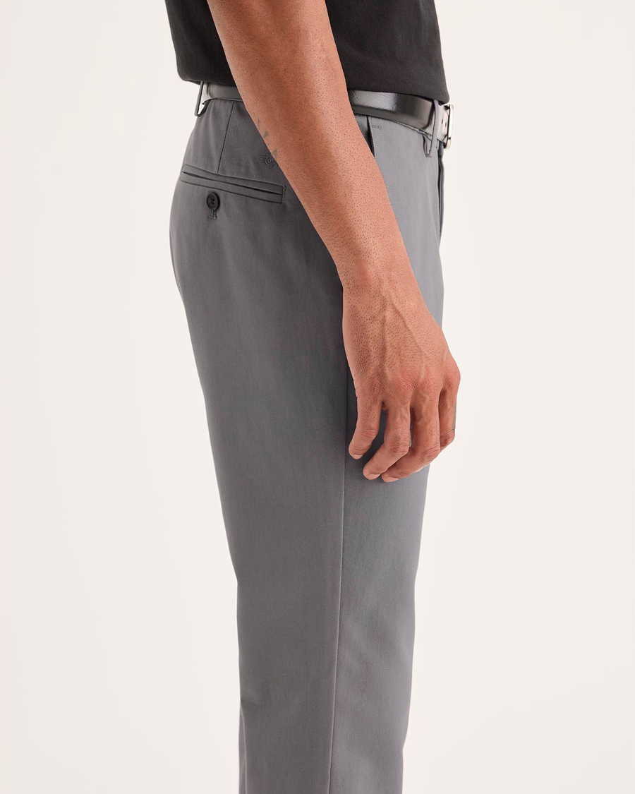 Side view of model wearing Burma Grey Signature Iron Free Khakis, Skinny Fit with Stain Defender®.