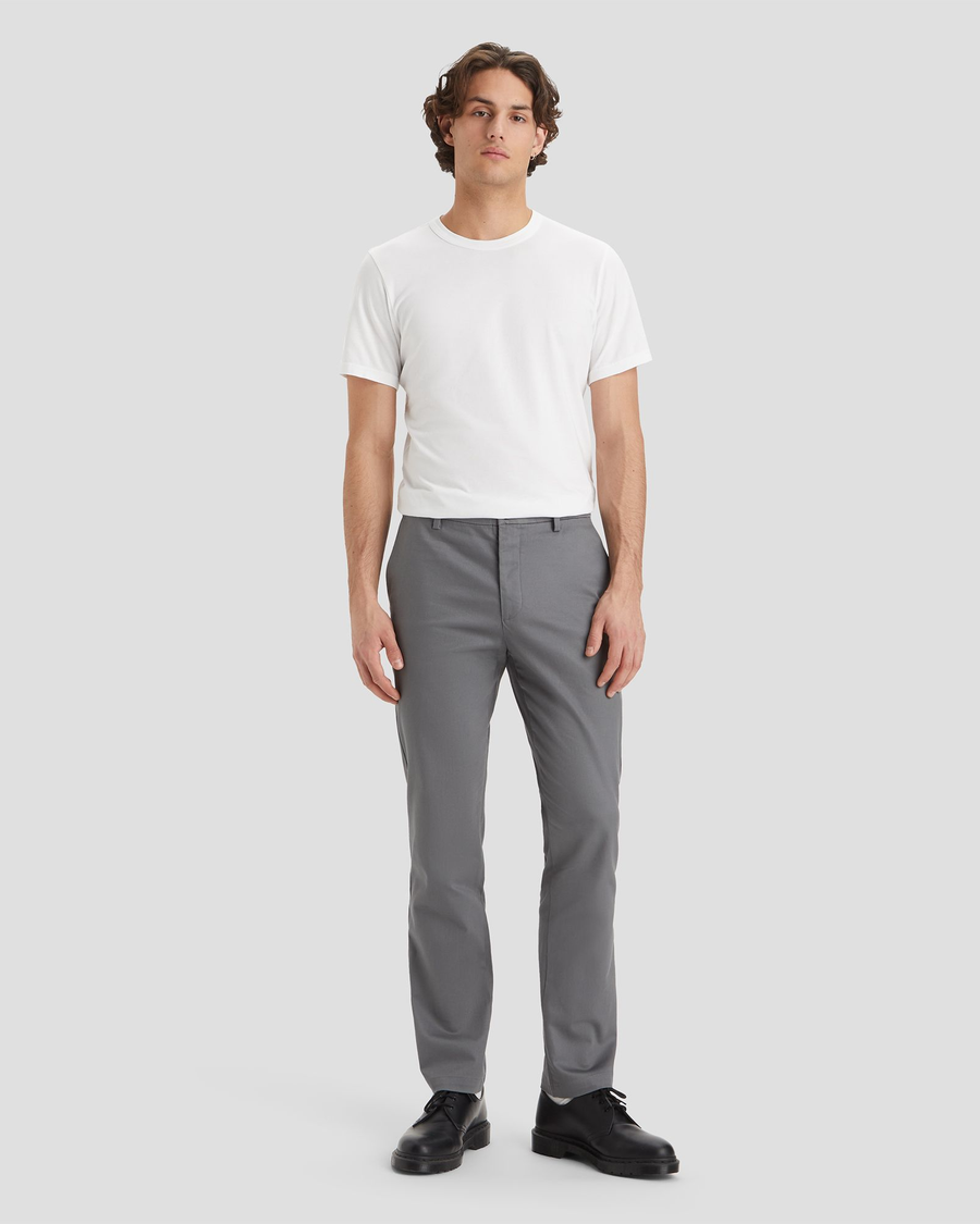 Front view of model wearing Burma Grey Signature Iron Free Khakis, Slim Fit with Stain Defender®.