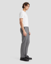 Side view of model wearing Burma Grey Signature Iron Free Khakis, Slim Fit with Stain Defender®.