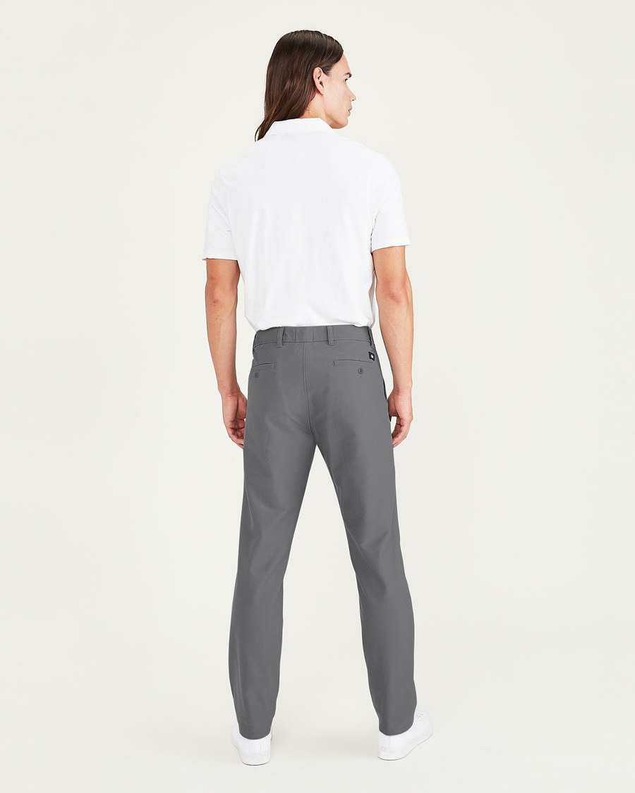 Back view of model wearing Burma Grey Smart 360 Flex Comfort Knit Chino Pants, Slim Fit.