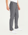 Side view of model wearing Burma Grey Smart 360 Flex Comfort Knit Chino Pants, Slim Fit.