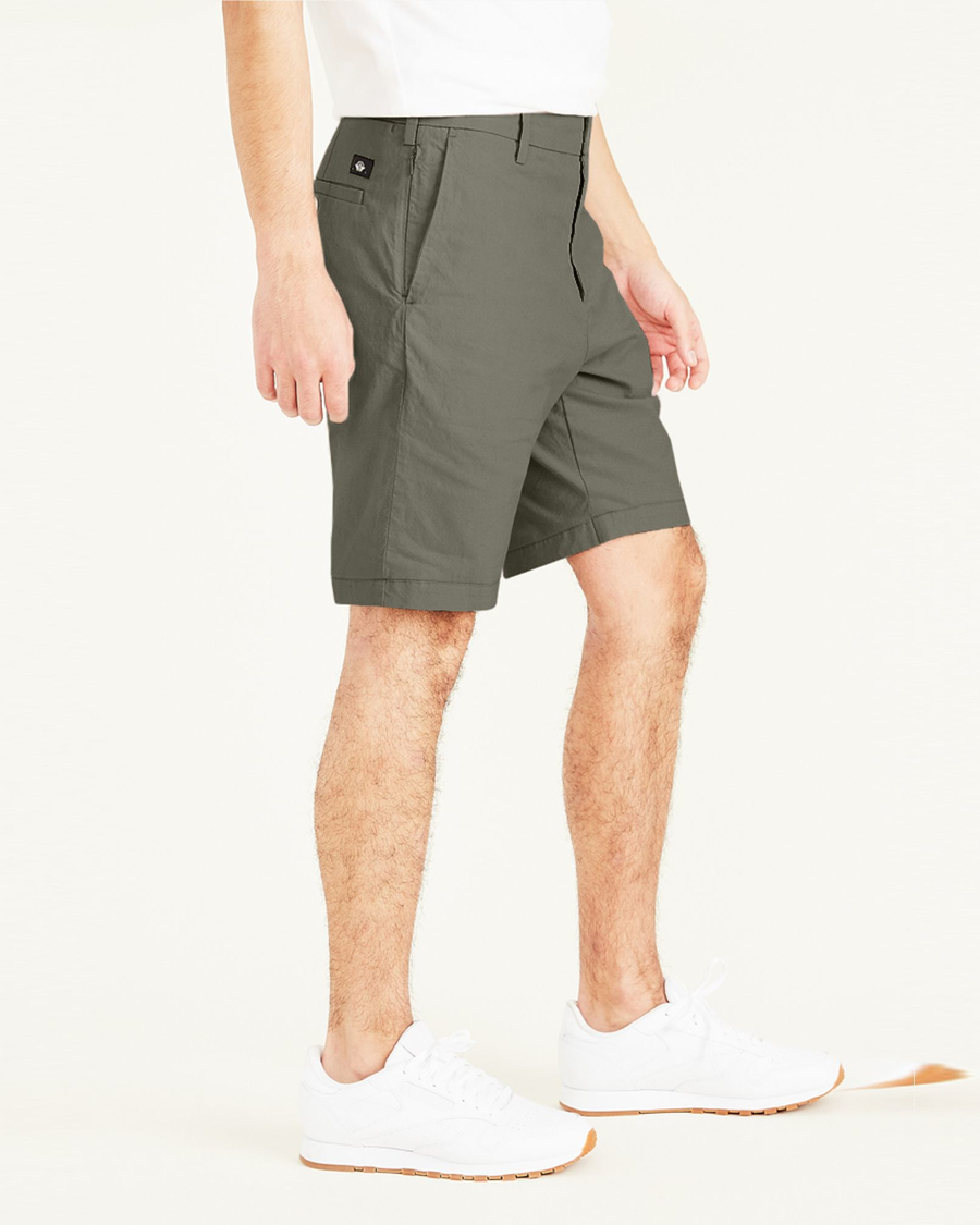 Side view of model wearing Camo Big and Tall Supreme Flex Modern Chino Shorts.
