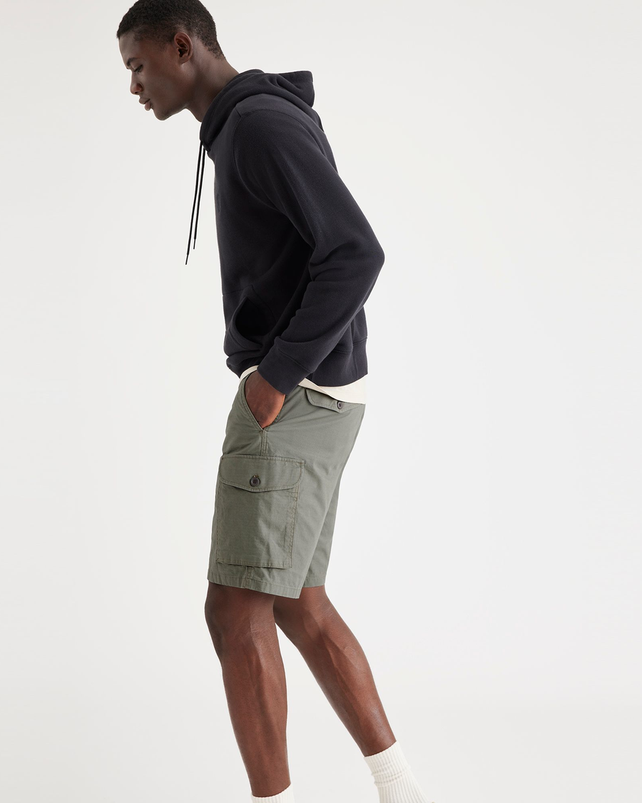 View of model wearing Camo Men's Cargo Shorts.