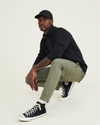 View of model wearing Camo Men's Slim Tapered Fit Cargo Pants.