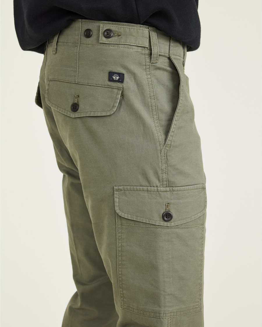 View of model wearing Camo Men's Slim Tapered Fit Cargo Pants.