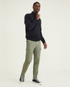 Front view of model wearing Camo Men's Slim Tapered Fit Cargo Pants.