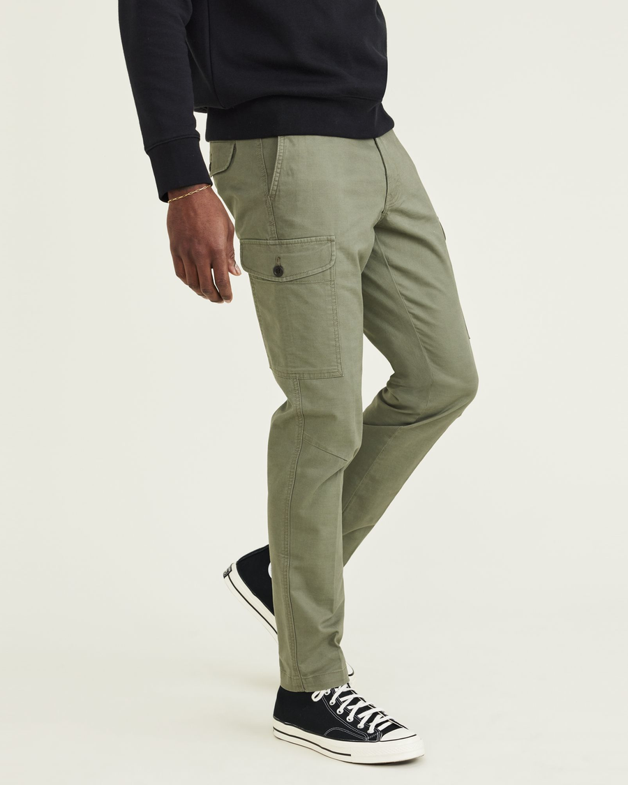 Side view of model wearing Camo Men's Slim Tapered Fit Cargo Pants.