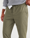 View of model wearing Camo Men's Straight Tapered Fit California Pull-On Pants.