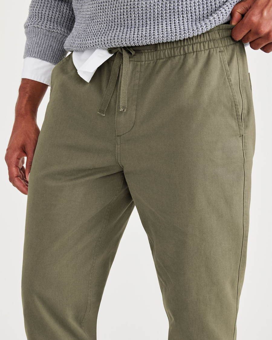 View of model wearing Camo Men's Straight Tapered Fit California Pull-On Pants.