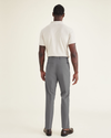 Back view of model wearing Car Park Grey Signature Go Khaki Pants, Slim Fit.