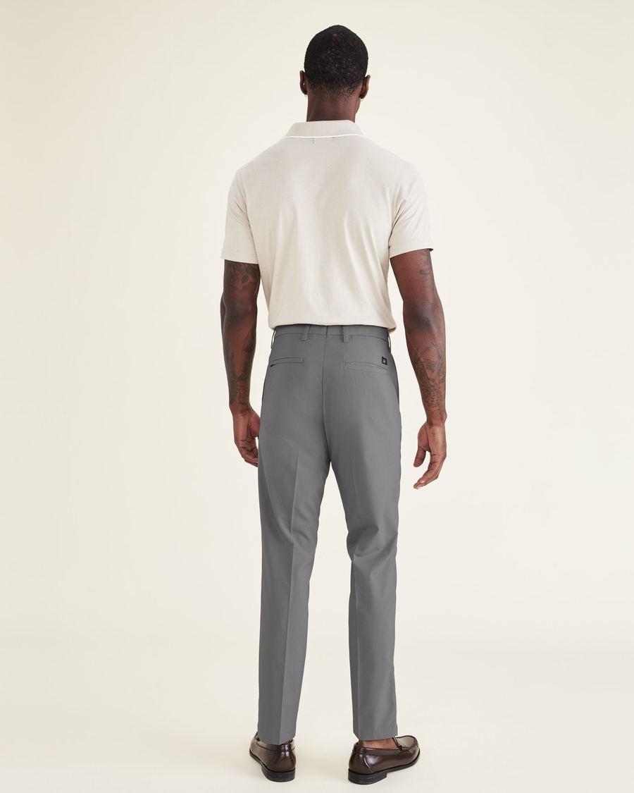Back view of model wearing Car Park Grey Signature Go Khaki Pants, Slim Fit.