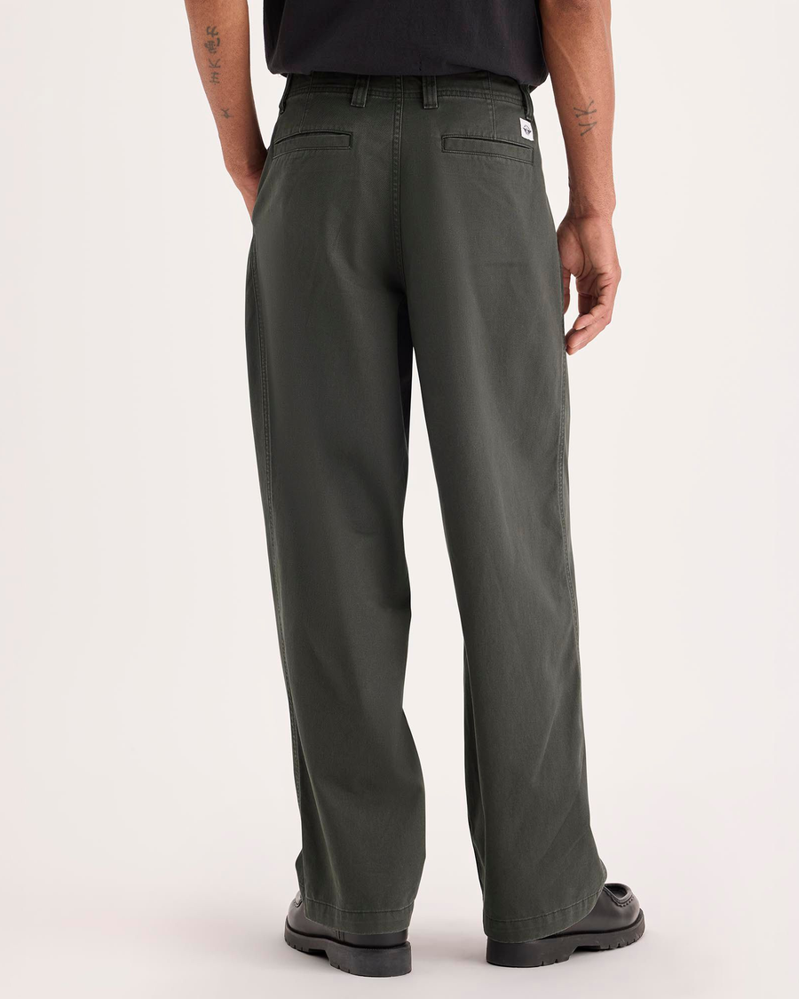 Back view of model wearing Chimera Eighty-Six Alpha Chino Pants, Loose Fit.