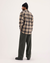 Back view of model wearing Chimera Eighty-Six Alpha Chino Pants, Loose Fit.