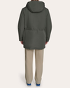 Back view of model wearing Chimera Faille Padded Parka.
