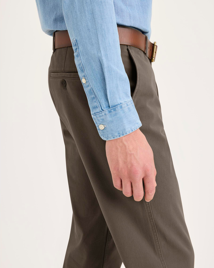 Side view of model wearing Chocolate Chip Essential Chino Pants, Slim Fit.