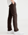 Side view of model wearing Coffee Bean Men's Skinny Fit Smart 360 Flex California Chino Pants.