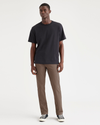 Front view of model wearing Coffee Quartz Men's Slim Fit Smart 360 Flex California Chino Pants.