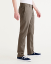 Side view of model wearing Crocodile Stonewash Men's Slim Fit Smart 360 Flex California Chino Pants.